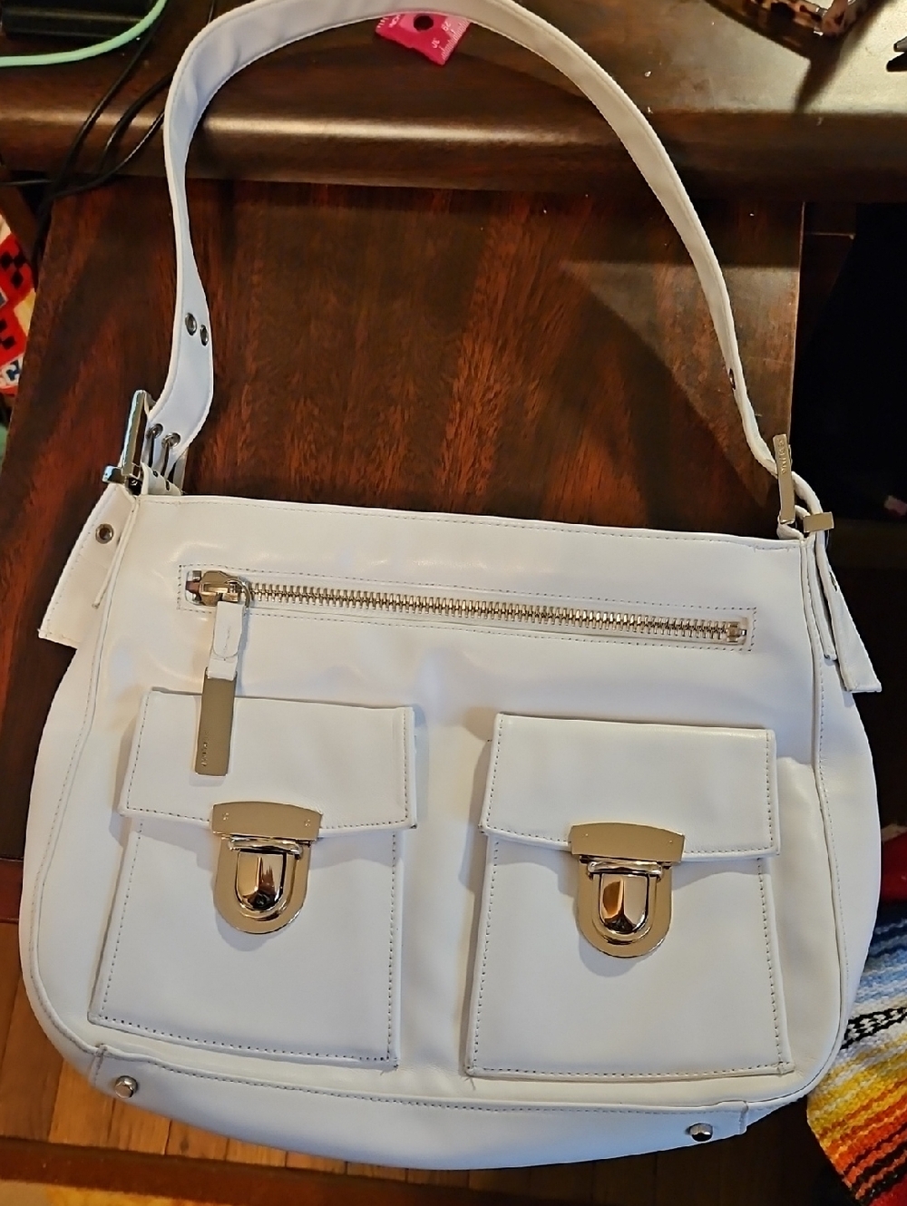 Perlina White Leather Shoulder Bag with Front Flap Pockets and Silver Hardware